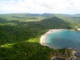 Ariel view of San Juan del Sur Nicaragua and surrounding green hills – Best Places In The World To Retire – International Living